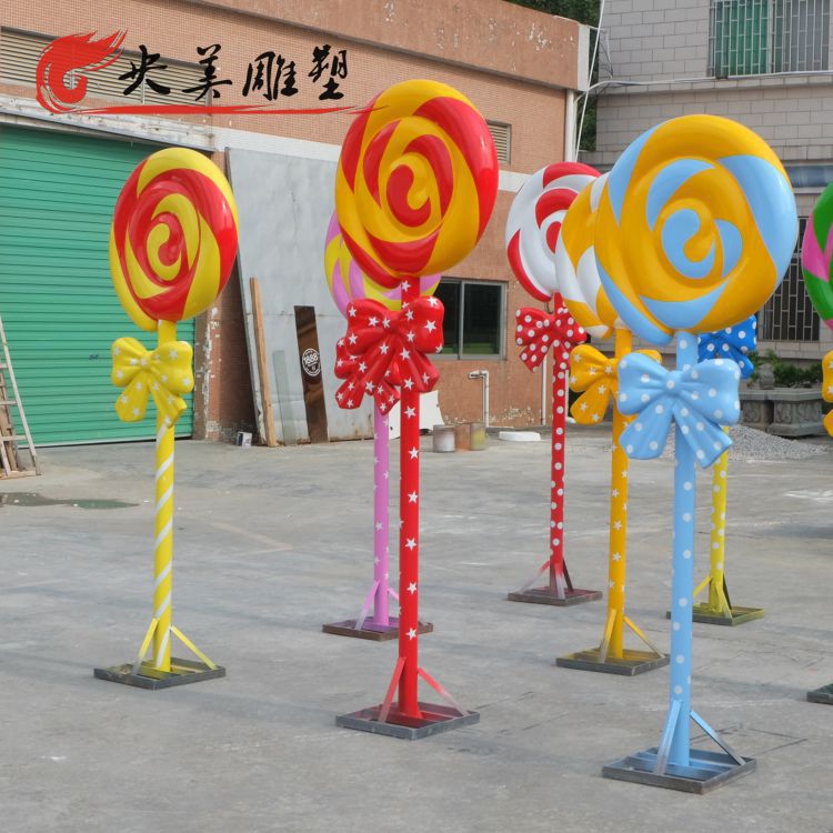 商场超市大型蝴蝶结彩色玻璃钢棒棒糖雕塑图片 商场超市大型蝴蝶结彩色玻璃钢棒棒糖雕塑图片